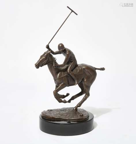 An American patinated bronze model of a polo player on horse...