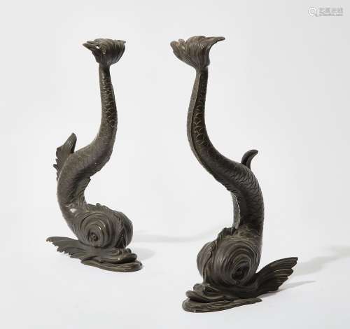 A pair of patinated bronze models of dolphins, late 19th/ear...