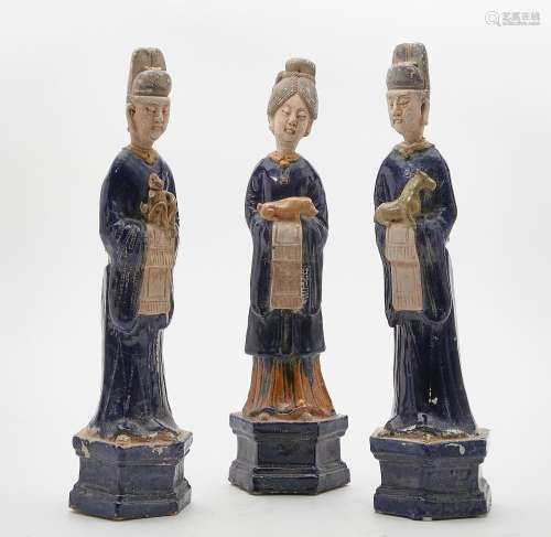 Three Chinese polychrome glazed pottery models of attendants