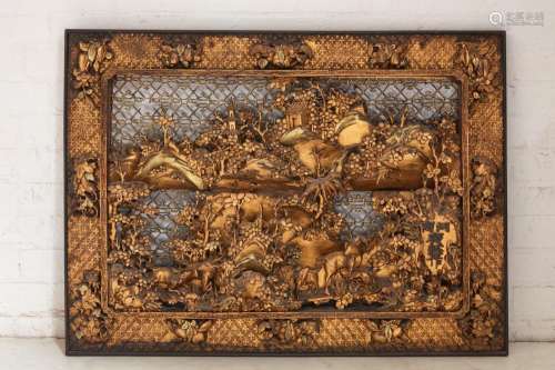 A Chinese giltwood relief landscape panel