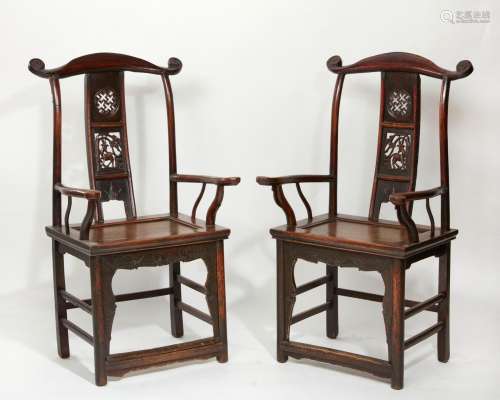 A pair of Chinese hardwood armchairs