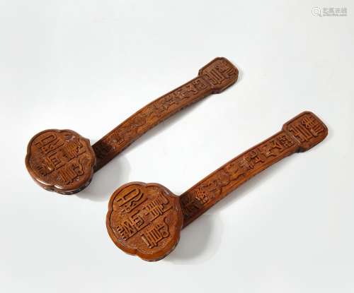 Two Chinese carved wood ruyi scepters