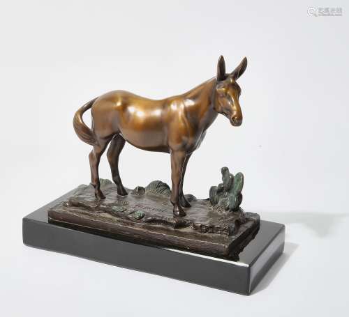 A patinated bronze animalier figure of a mule with cacti, mo...