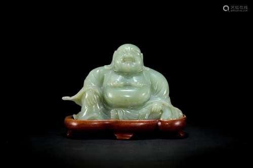 A Carved Jadeite Maitreya Figure