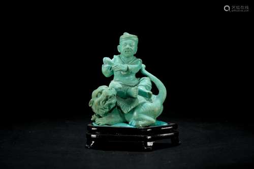 A Carved Turquoise Child and Tiger Figure