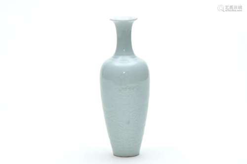 A Celadon Carved Dragoon Vase with Kangxi Mark
