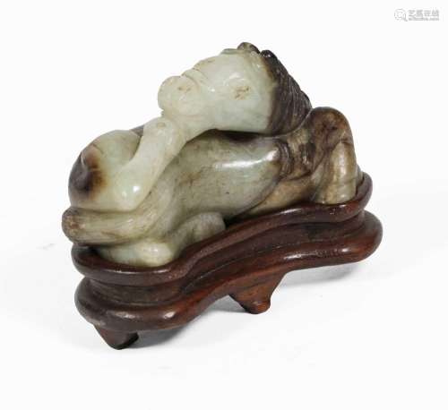 A Chinese Celadon and Russet Jade Horse, Ming Dynasty, worke...