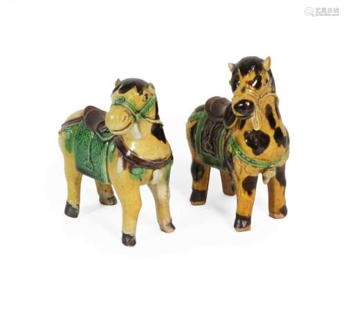 A Chinese Sancai Porcelain Figure of a Horse, Kangxi, standi...