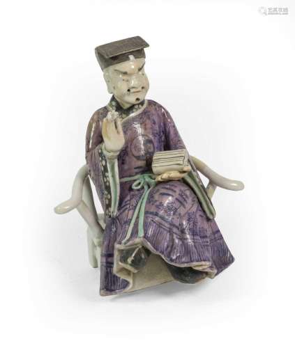 A Chinese Porcelain Figure of a Dignitary, Qianlong, sitting...