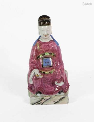 A Chinese Porcelain Figure of a Seated Dignitary, 19th centu...