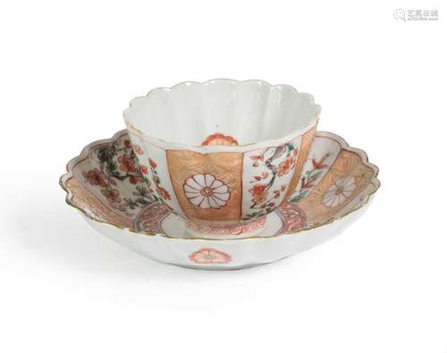 A Chinese Porcelain Tea Bowl and Saucer, Kangxi, of fluted f...