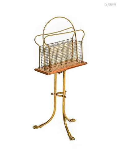 An Early 20th Century Oak and Brass Revolving Magazine Rack,...