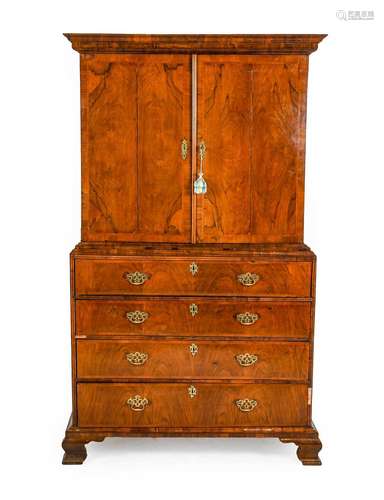 A Walnut and Feather-Banded Cabinet on Stand, the moulded co...