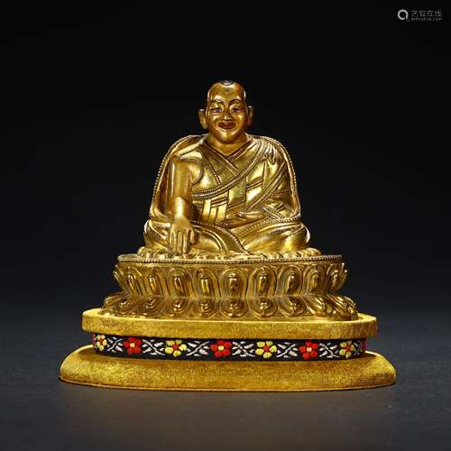 Ancient bronze-gilded guru statue