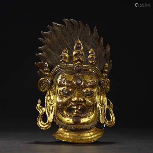 Ancient bronze gilded Buddha head