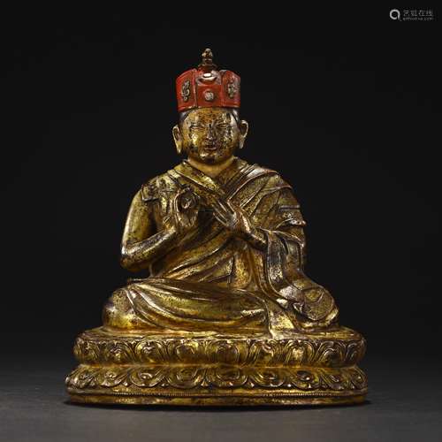 Ancient bronze-gilded guru statue