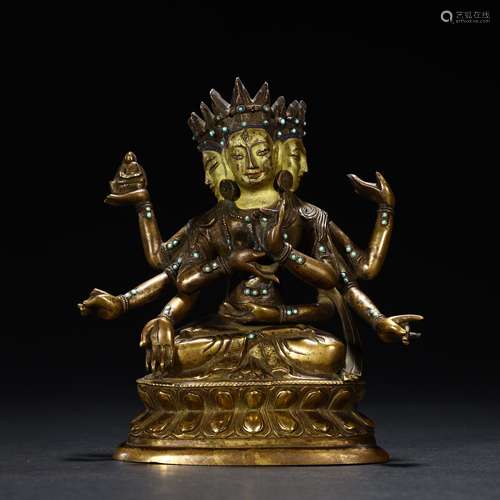 Copper-gilded Buddha statue with three heads and eight arms