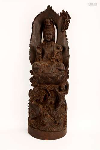 A CHINESE ROSEWOOD OR HARDWOOD STATUE CARVED WITH FIGURE OF ...