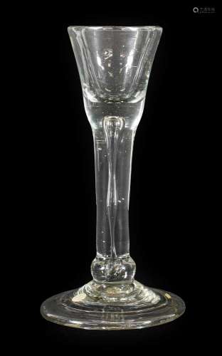 An Irish Cordial Glass, circa 1745, the drawn ogee bowl with...