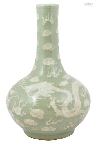 A Chinese Porcelain Bottle Vase, 19th century, carved in rel...