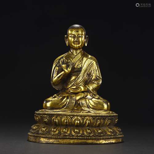 Ancient bronze-gilded guru statue