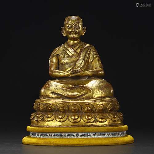 Ancient bronze-gilded guru statue