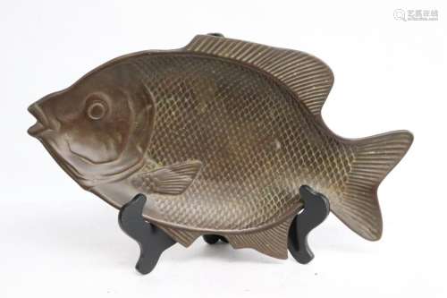 A Japanese cast iron plate in the form of fish