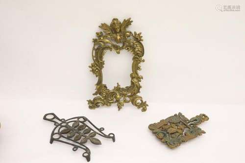 2 bronze trivets and a bronze picture frame