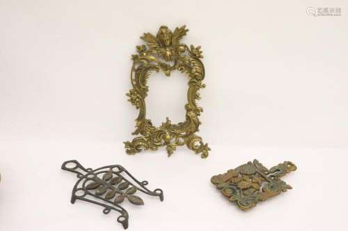 2 bronze trivets and a bronze picture frame