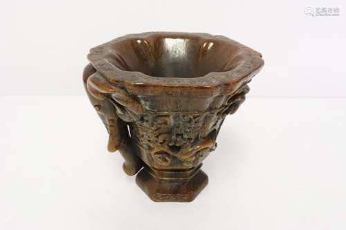 A simulated horn libation cup