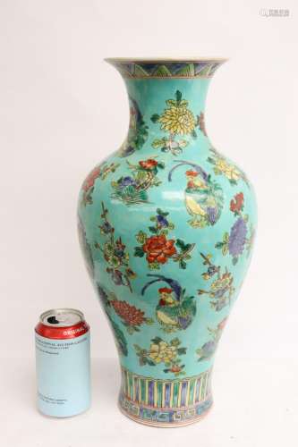 A fine green background famille rose vase