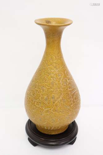 A brown glazed porcelain vase