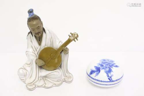 A porcelain figure and a b&w porcelain box