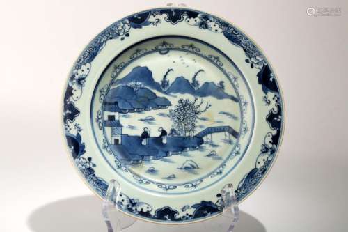 A BLUE AND WHITE DISH WITH THE LANDSCAPE SCENERY