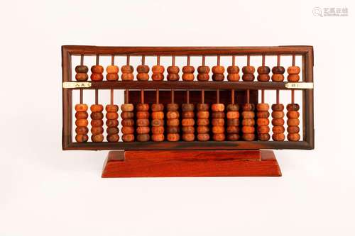 A HUANGHUALI WOOD ABACUS. MODEL AND BOX.M053.