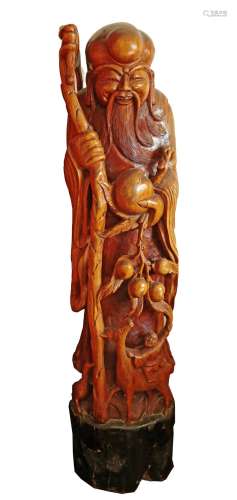 A LARGE NANMU WOOD STATUE CARVED WITH CHINESE GOD OF LONGEVI...
