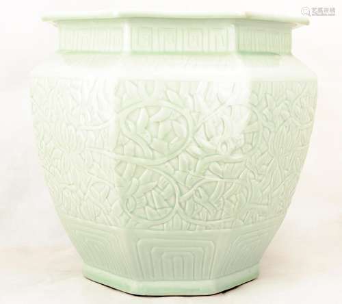 A GREEN GLAZE PORCELAIN JAR CARVED WITH LOTUS FLOWERS. C301.