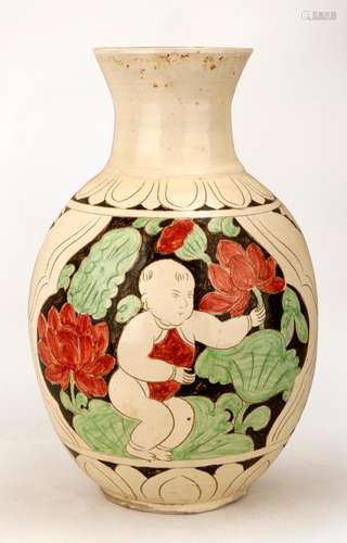 A CIZHOU WHITE GLAZED PORCELAIN VASE CARVED WITH LOTUS FLOWE...