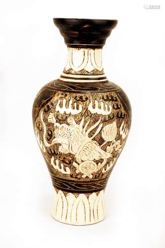 A CIZHOU BLACK GLAZED PORCELAIN VASE CARVED WITH KIRINS AND ...