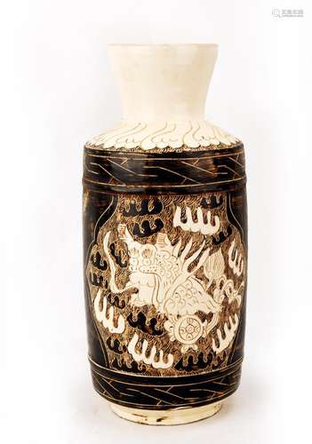 A CIZHOU WHITE GLAZED PORCELAIN WINE POT CARVED WITH LIONS.C...