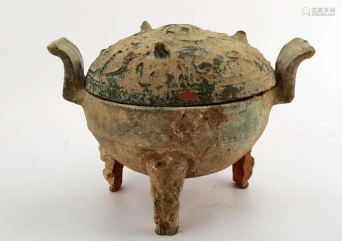 A HAN DYNASTY GREEN GLAZED DING-FORM JAR AND COVER.