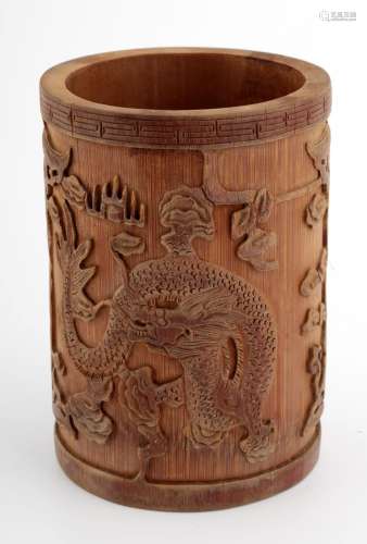 A CHINESE CARVED WITH DRAGONS BAMBOO BRUSH POT.