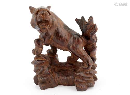 A CHINESE HARDWOOD STATUE OF A TIGER