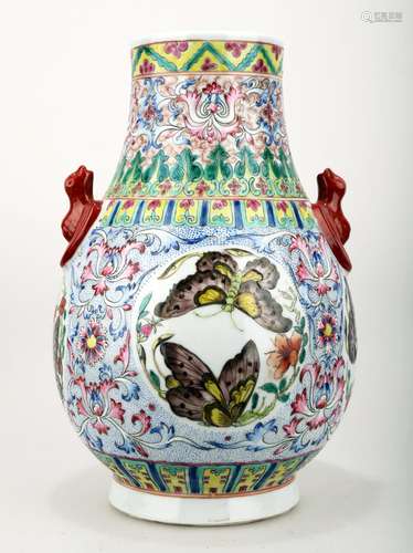 A FAMILLE ROSE PORCELAIN VASE WITH BAT HANDLES AND BUTTERFLY...