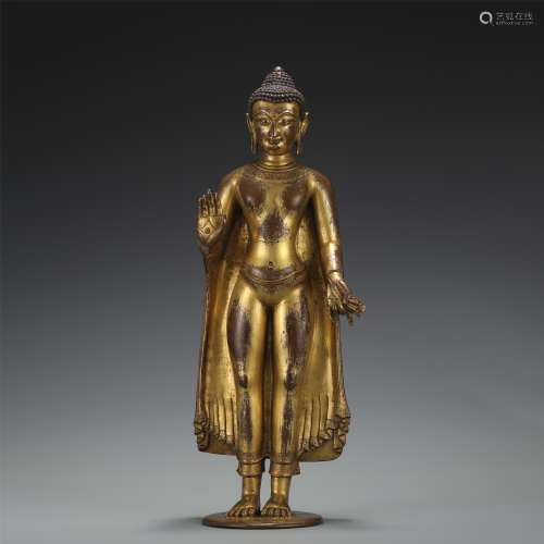 A FIGURE OF BUDDHA STANDING STATUE