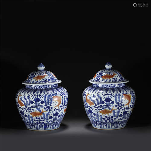 A PAIR OF BLUE AND WHITE IRON RED GLAZE PORCELAIN LIDDED JAR...