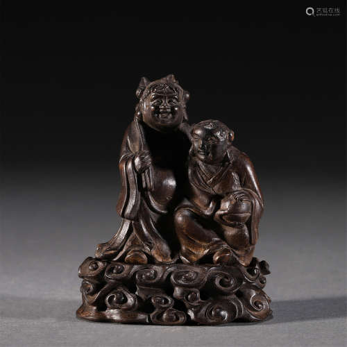 A CARVED CHENXIANG FIGURE ORNAMENTS