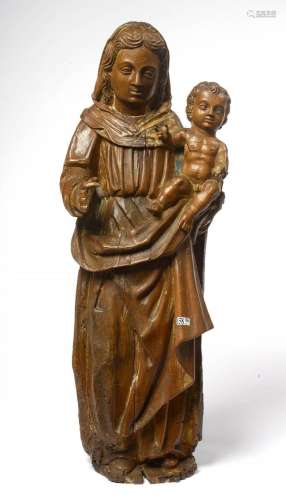 "Vierge à l'Enfant" en noyer sculpté portant d...