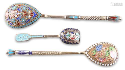 THREE RUSSIAN SILVER AND ENAMEL SPOONS, the first by Gustav ...