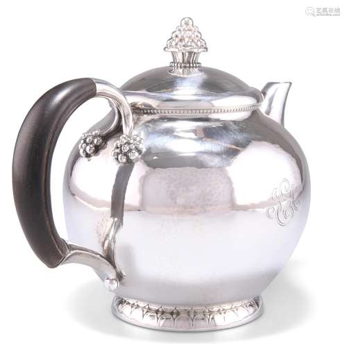 A DANISH STERLING SILVER TEAPOT, CIRCA 1930, by Georg Jensen...